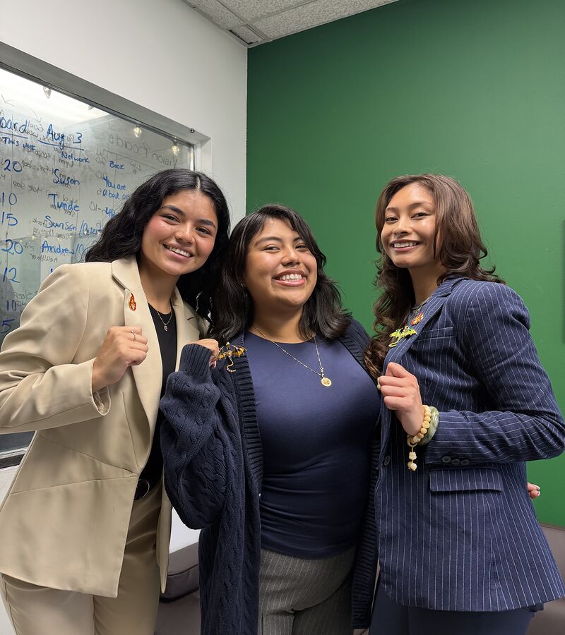 Three members of the Valorix Agency team at the whiteboard in the Parsippany office